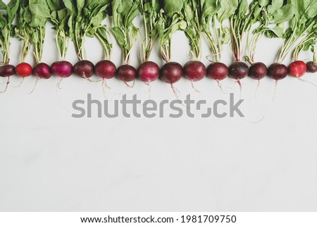 Fresh radishes on a marble surface