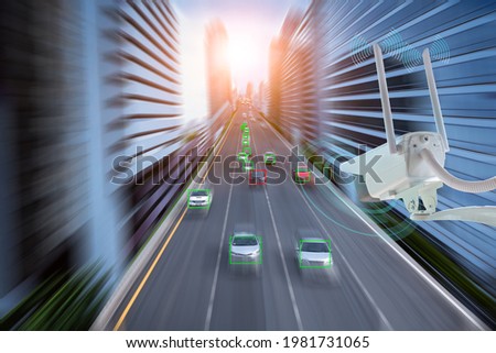 Hi technology CCTV camera WiFi intelligence AI 5G systems monitoring safety and protect accident on high speed road for check car over hi speed show in red block is technology for safety concept. Royalty-Free Stock Photo #1981731065