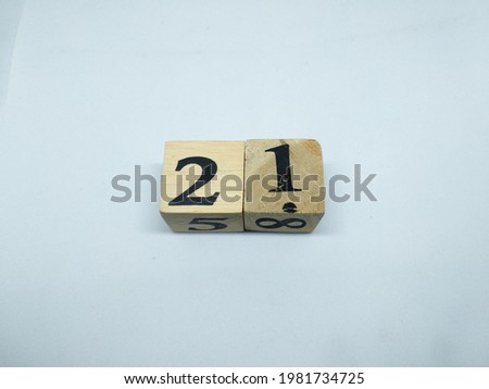  number 21 on wooden box and white background
