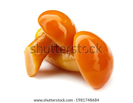 Tasty pickled mushrooms are isolated on a white background. Pickled honey fungus. Royalty-Free Stock Photo #1981748684