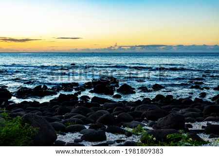 sunset over the rocky at the beach of Albion in the west of the republic of Mauritius
