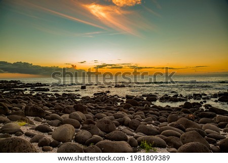 sunset over the rocky at the beach of Albion in the west of the republic of Mauritius