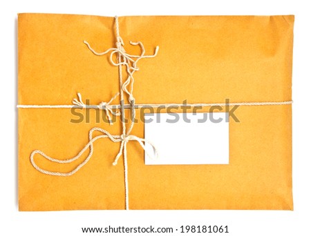 shipping parcel tied with twine and a blank shipping tag for copy space