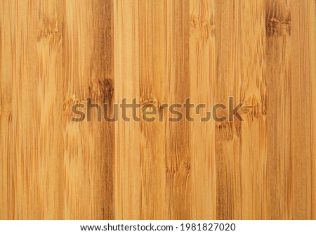 New bamboo wood cutting board surface textured background