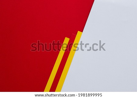 White and red with yellow stripes diagonally divided background Royalty-Free Stock Photo #1981899995