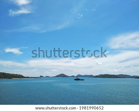The picture of a ship sailing on the sea