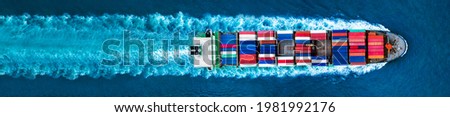Aerial top view of container ship with contrail in the ocean sea ship carrying container and running for export from container international port to custom ocean concept freight shipping  forwarder