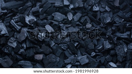 Natural black coals close up. Top view picture.