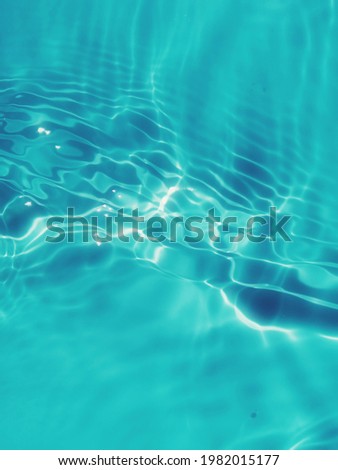 ​ Closeup ​abstract​ of​ surface​ blue​ water. Abstract​ of​ surface​ blue​ water​ reflected​ with​ sunlight​ for​ background. Blue​ sea. Blue​ water.​ Water​ splashed​ use​ for​ graphic​ design.Water