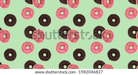 A seamless repeating pattern of traditional American doughnuts. Bright green background with different pink and black donuts. Top view.