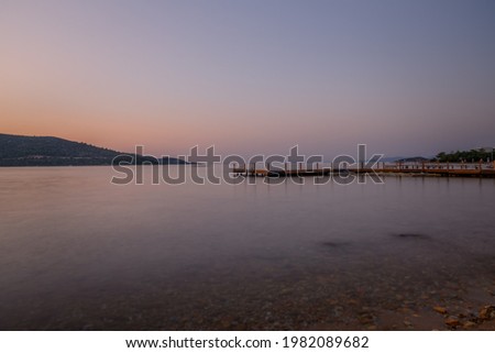 sunset over bay in Aegean sea. Torba, Bodrum, Turkey. October 2020. Long exposure picture