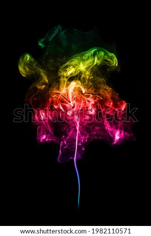 A colorful smoke spiral pattern in rainbow colours on black background.