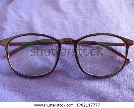 Eye Glasses on Purple background
