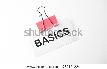 Finance and business concept. On a white background is a marker and a business card with the inscription - BASICS
