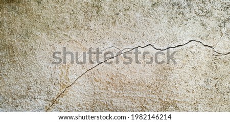 Cracks in old cement walls, damage to cement floors, danger