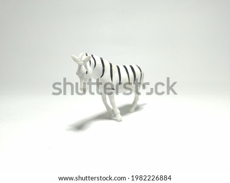 Plastic Toy Zebra on white background