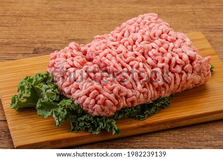 Raw pork minced meat with spices for cooking