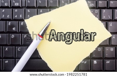 Angular web framework. Word Angular on paper and laptop  Royalty-Free Stock Photo #1982251781