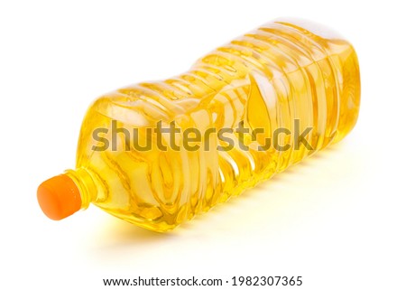 close up vegetable or sunflower oil in plastic bottle isolated on white