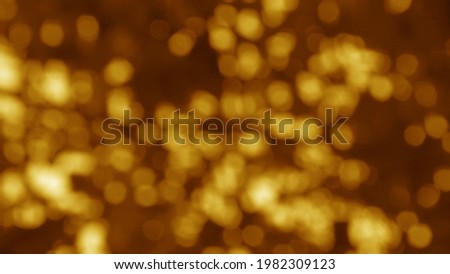 Abstract glittering blurred brown background.