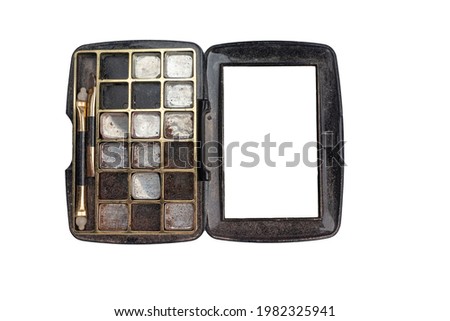Old broken makeup eyeshadow palette on white background top view