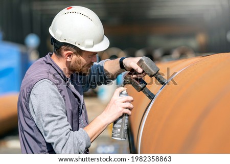 Magnetic particle testing (MPT), or magnetic particle inspection, is a non destructive examination (NDE) technique used to detect surface and slightly subsurface flaws in most ferromagnetic materials. Royalty-Free Stock Photo #1982358863