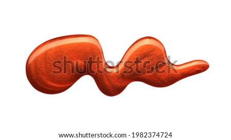 Blot of orange nail polish isolated on white background. Photo. Top view