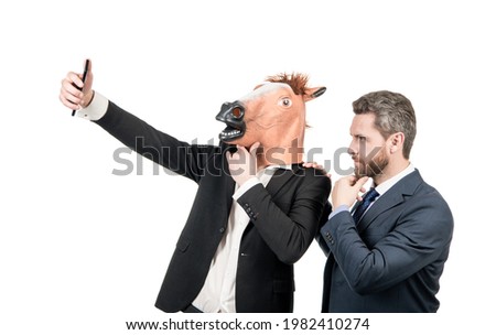 Live streaming with your phone. Employees take selfie with smartphone. Mobile live streaming Royalty-Free Stock Photo #1982410274
