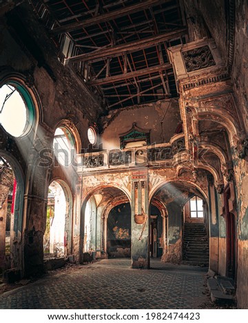 Light coming through windows in the haunted Spicer castle in Serbia Royalty-Free Stock Photo #1982474423