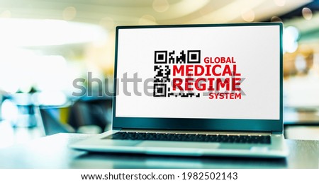 Laptop computer displaying the sign of a Global Medical Regime System