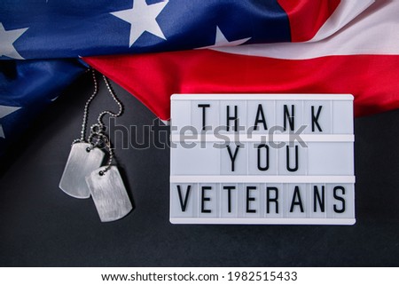 Memorial Day in the United States. Thanks to the veterans. Military dog tags and American flag. Celebration concept.