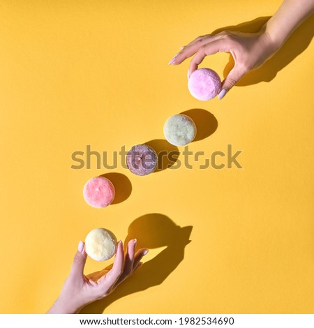 Japanese ice cream Mochi in rice dough. Traditional Japanese dessert on a yellow background. Concept with hard shadows