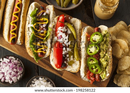 Gourmet Grilled All Beef Hots Dogs with Sides and Chips Royalty-Free Stock Photo #198258122