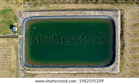 Aerial view of a water tank (pool) for irrigation in agriculture.
