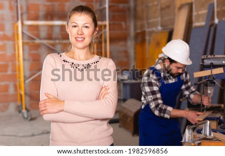 Female designer at construction site. High quality photo