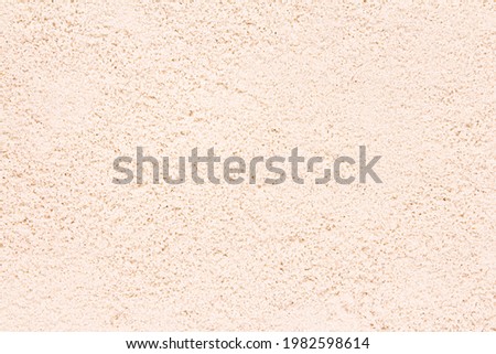 Sand background. Natural sandy texture closeup, copy space.
