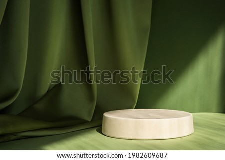 Abstract minimal scene with geometrical form. Cylinder podium on green background. Abstract background. Scene to show cosmetic podructs. Showcase, display case. 3d render. Royalty-Free Stock Photo #1982609687