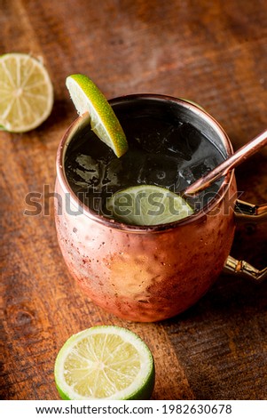 Moscow Mule. Cocktails. American Cocktail made with vodka, spicy ginger beer, lime juice and garnished with a slice or wedge of lime and mint. Classically served in a copper mug. 