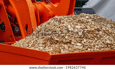 sawdust after wood processing, secondary raw materials Royalty-Free Stock Photo #1982637746