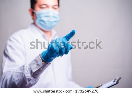 Doctor working with clipboard of medication history records and touch in the air . closeup. Perfect medical service in hospital.