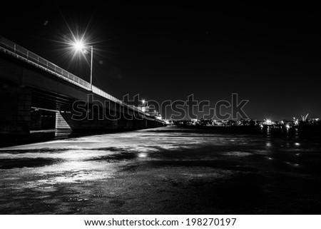 The George Mason Memorial Bridge at night, over the frozen Potomac River in Washington, DC.