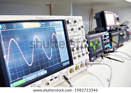 Modern mixed signal oscilloscope in laboratory Royalty-Free Stock Photo #1982713346