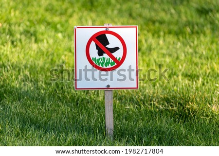 Sign Do not step on grass. Prohibition sign on the lawn. Sign prohibiting walking on the grass.