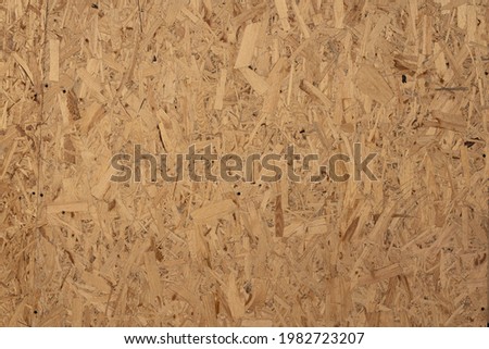 Osb plywood texture close up. Seamless background. Pressed wood texture osb