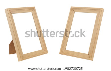 Set of two vertical standing empty beige wooden frames for artwork or photo isolated on white background