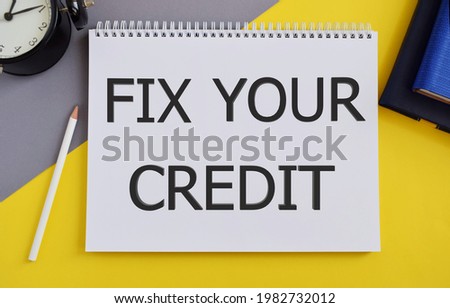 Fix Your Credit text written in Notebook. Conceptual photo Keep balances low on credit cards and other credit