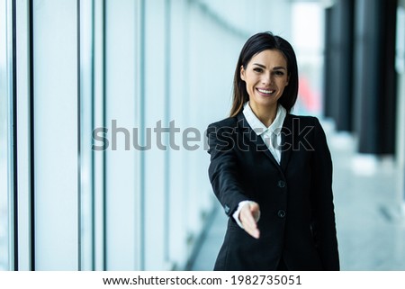Businesswoman offer hand to shake as hello in office closeup.
