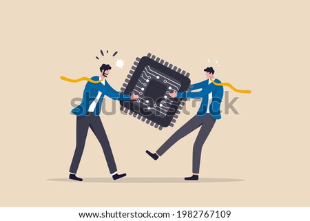 Semiconductor and computer chip supply chain shortage due to Coronavirus COVID-19 pandemic, electronics manufacturing problem concept, businessman tug of war fighting to get computer chip. Royalty-Free Stock Photo #1982767109