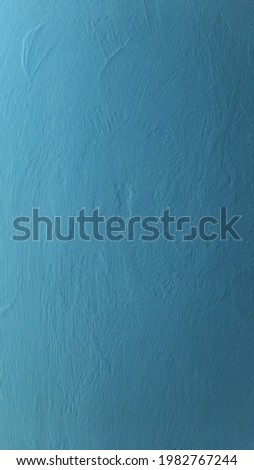 A textured blue background with a grainy texture