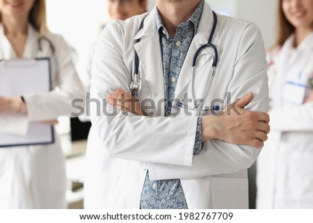 Team of doctors is standing in medical office